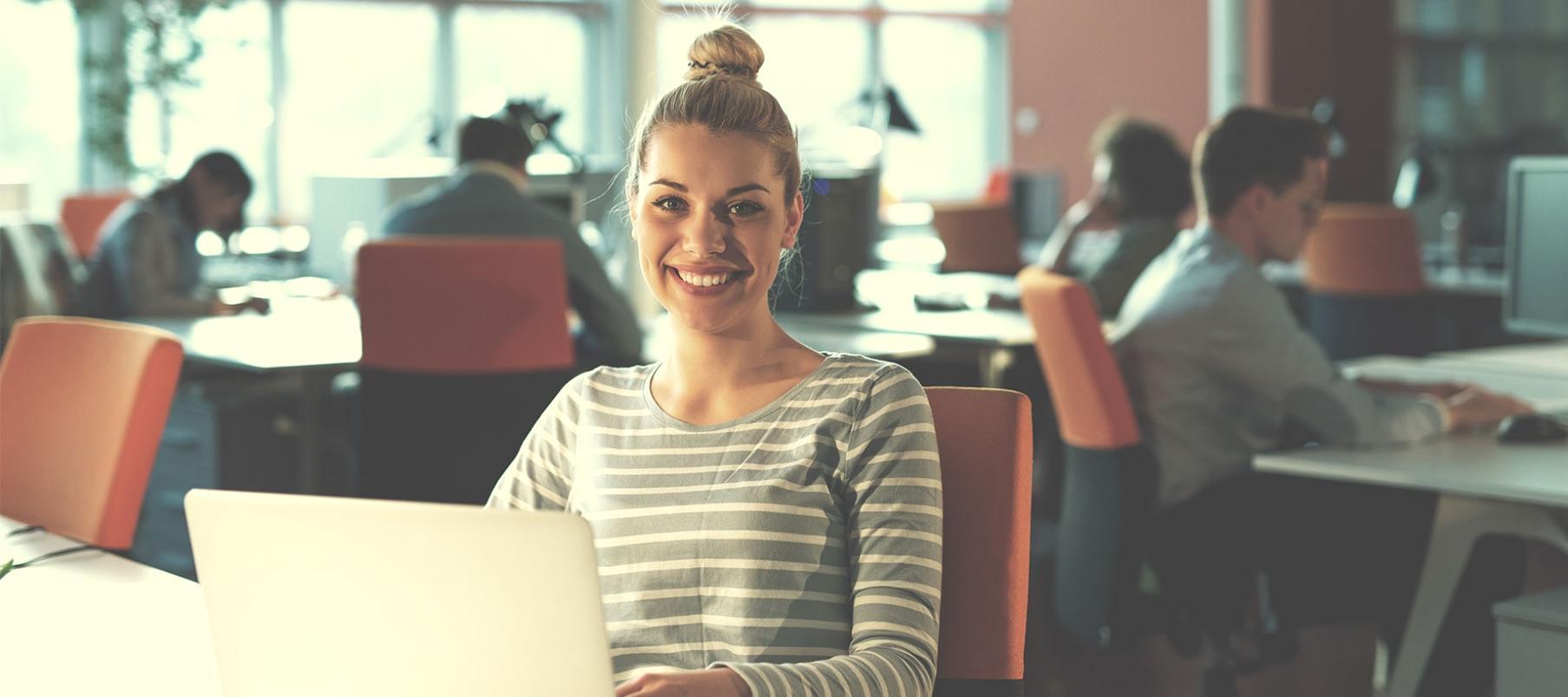 Workshop participant analyzing SEO data on multiple screens